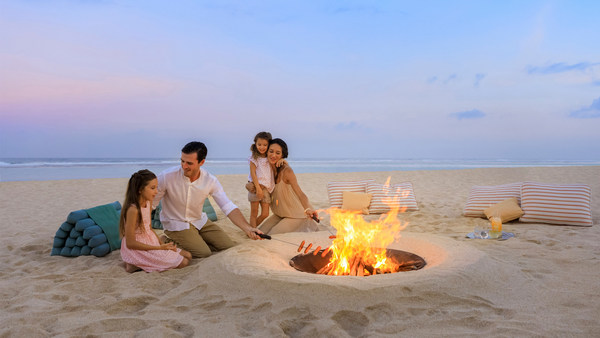 Enjoy unforgettable family holiday with a fun bonfire by the beach at The Ritz-Carlton, Bali